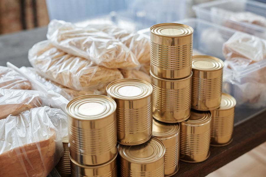 A pantry organised into matching labelled jars