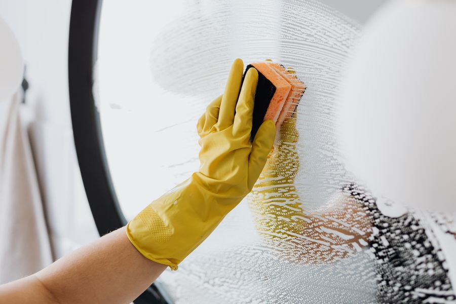 Wiping a bathroom mirror to a streak-free finish